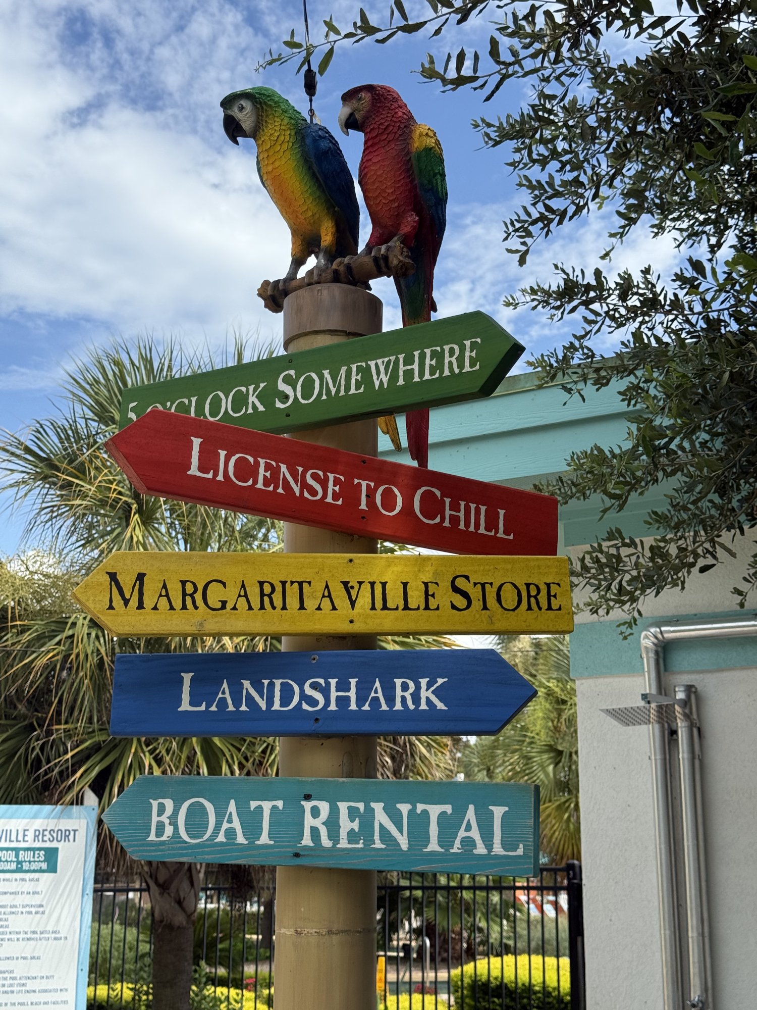 Margaritaville Lake Resort signpost with parrots on Lake Conroe, Texas